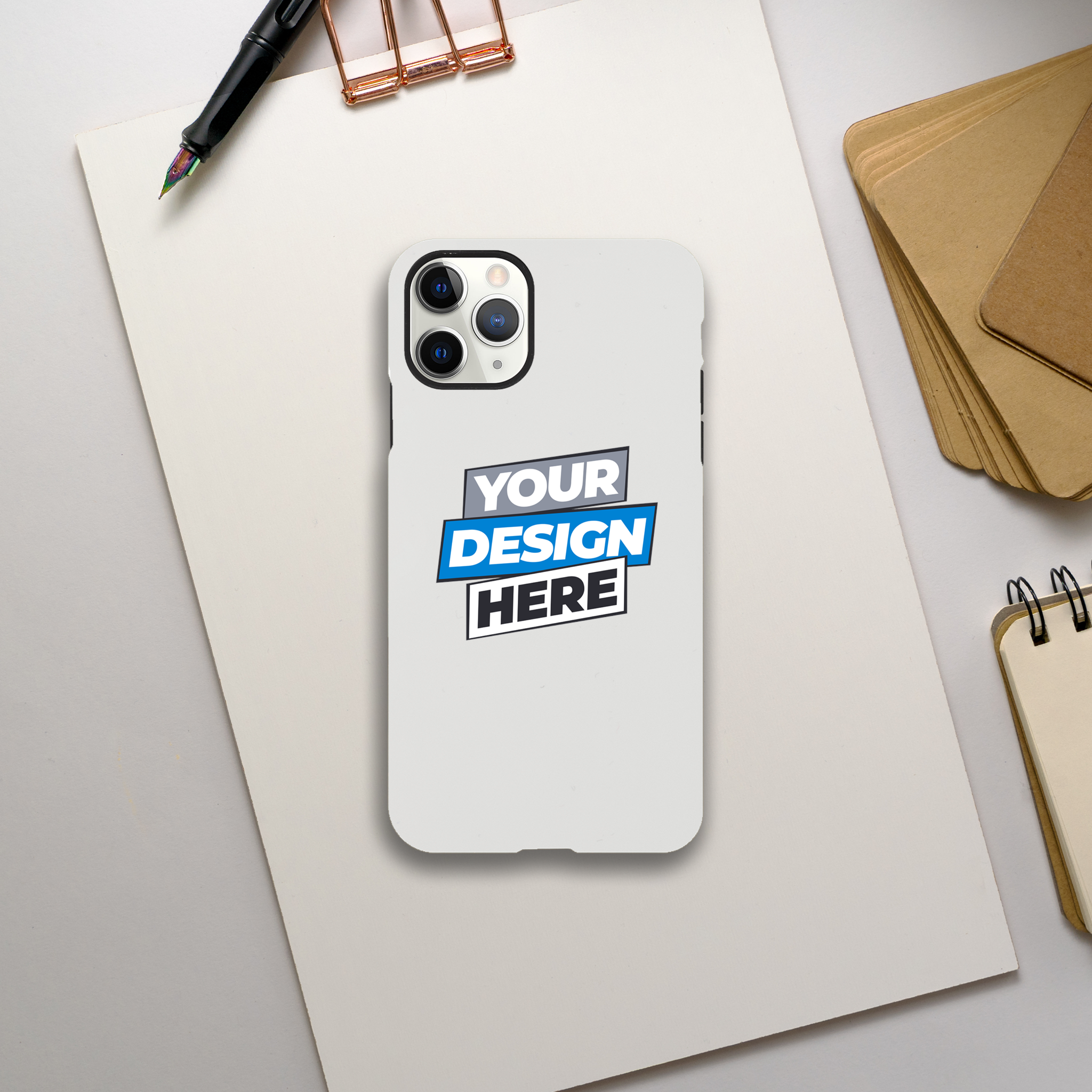 Glossy iPhone case with customizable design, dual-layer protection, and wireless charging compatibility on a desk.