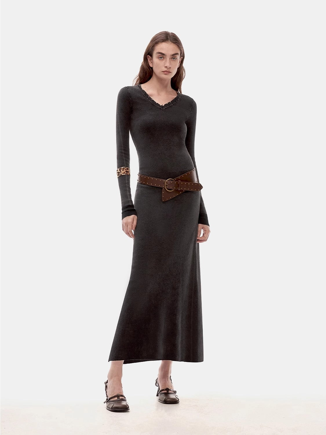 Selvara Distressed Cotton V-Neck Dress with raw-cut neckline, vintage character, and contrast-tipped cuffs, worn by a model.