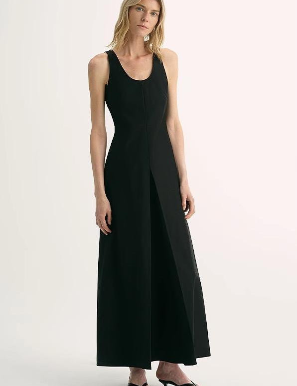 Woman wearing Luretta Silk-Blend U-Neck A-Line Dress in black, showcasing elegant silhouette and smooth fabric.