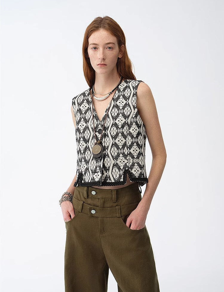 Model wearing Velgrana Jacquard Heritage Vest with ethnic-inspired pattern, highlighting refined silhouette and Italian weaving tradition.