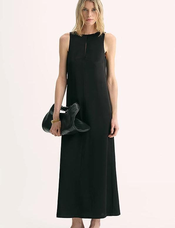 Model wearing Corridor Stride Sleeveless Wool Blend Dress, showcasing A-line silhouette, vertical neckline, and discreet side pockets.