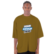 Man wearing men's oversized drop-shoulder crewneck t-shirt in brown with 'Your Design Here' text on the front, showcasing streetwear style.