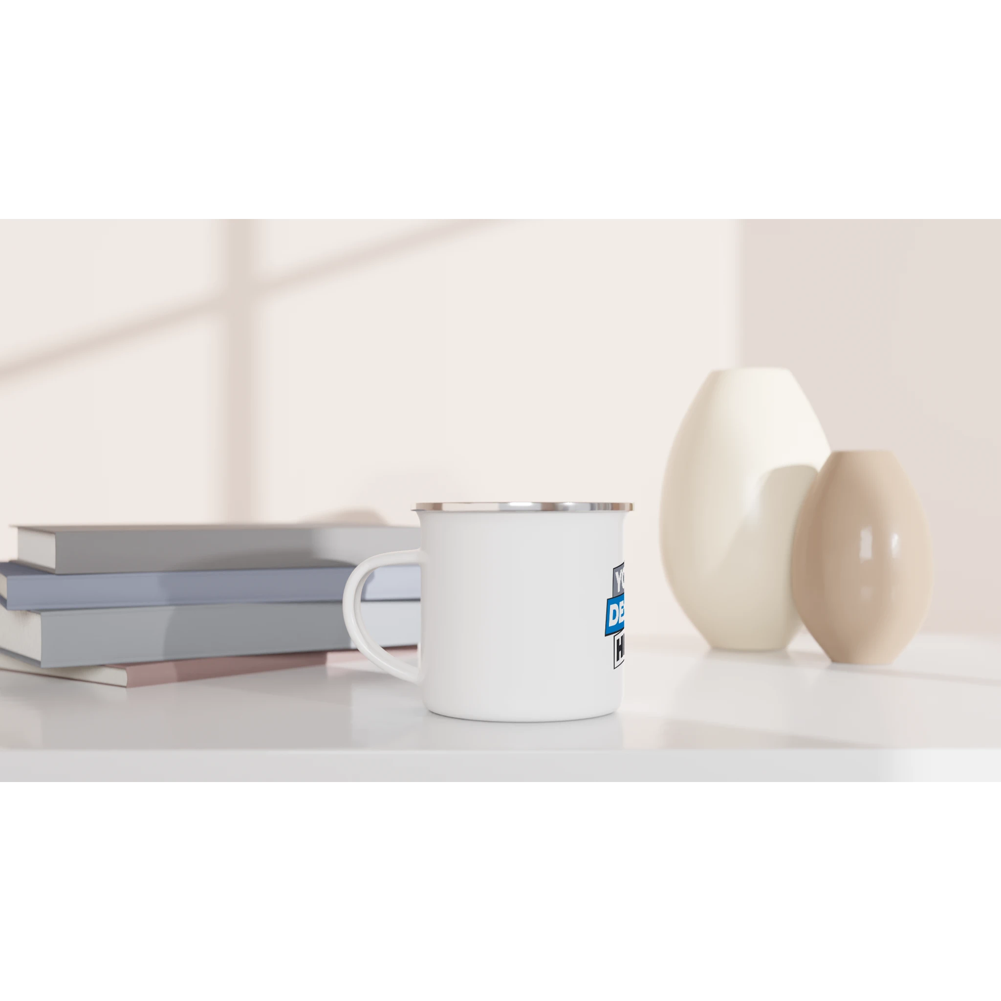 White enamel mug 12oz with silver rim on a table, ideal for outdoor adventures and custom designs.