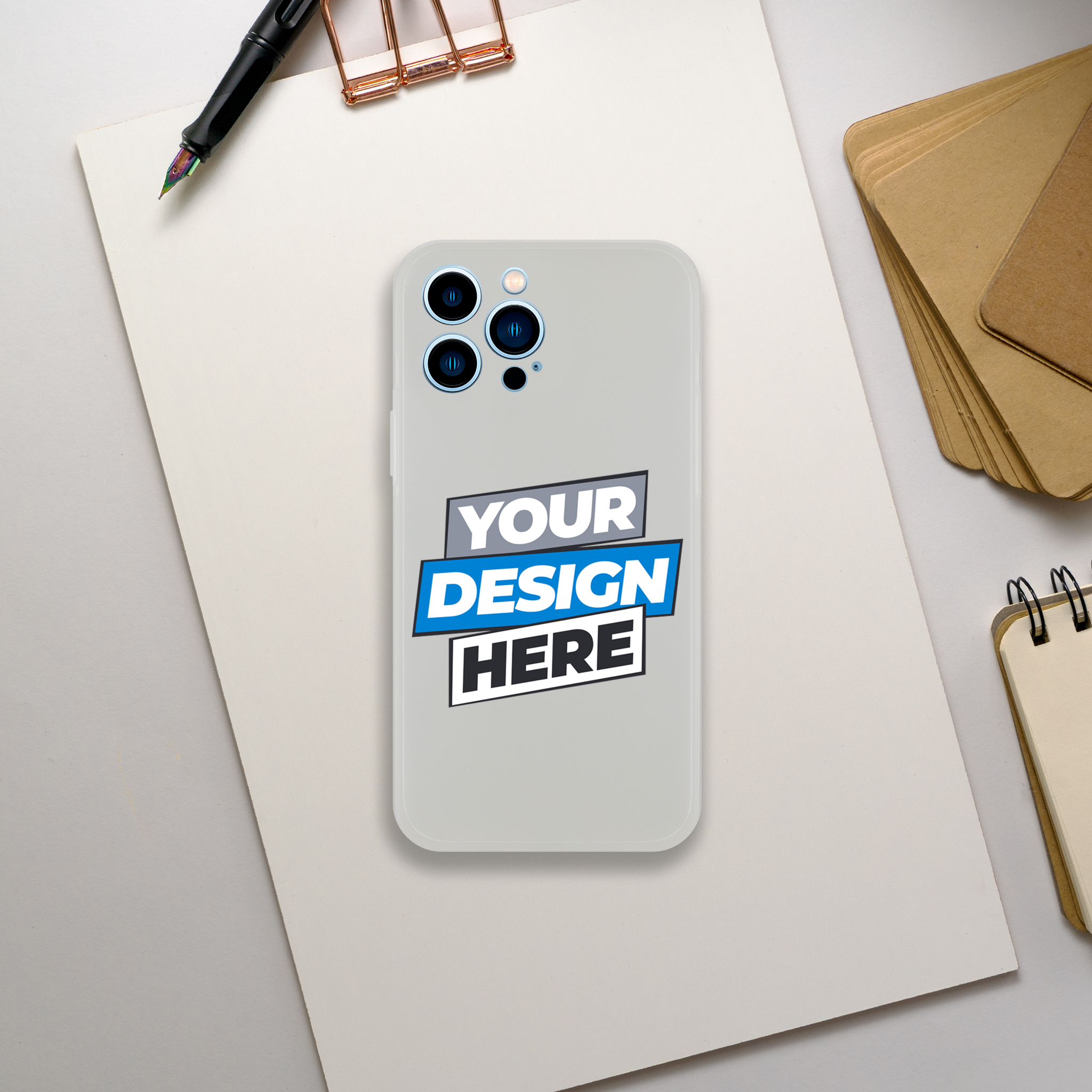 Transparent Flexi Case with customizable design slot on a table with a pen and notepad; ideal for creative art display.