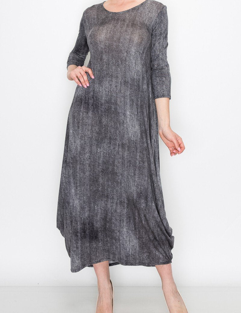 4 sleeves and a round neckline, showcasing a soft, artistic pattern and voluminous silhouette.