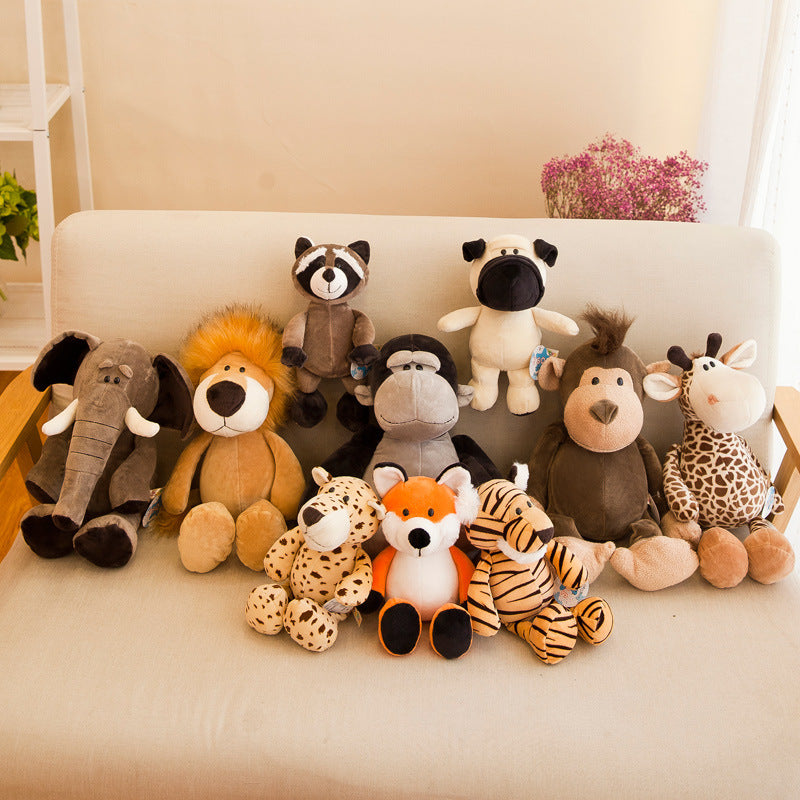 jungle animal plush toys collection with lion, elephant, raccoon, giraffe, tiger, fox, monkey, and zebra on a white couch