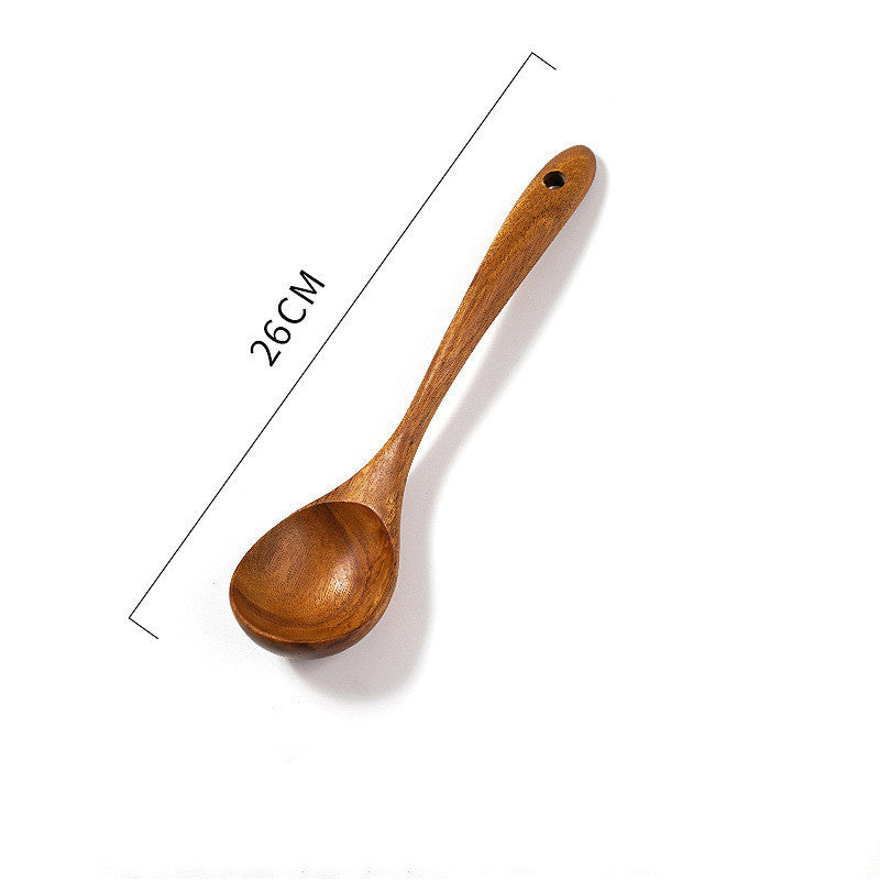 Wooden spatula measuring 26cm, made from teak, ideal for non-stick woks and stir-fry cooking.