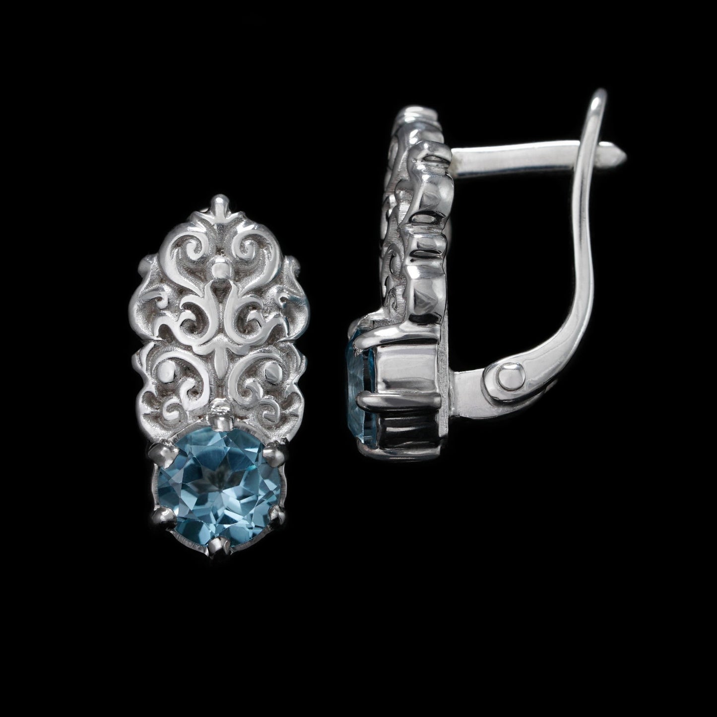 Sterling silver "Regal Grace" earrings with white rhodium plating and topaz gemstones, exuding elegance and sophistication.