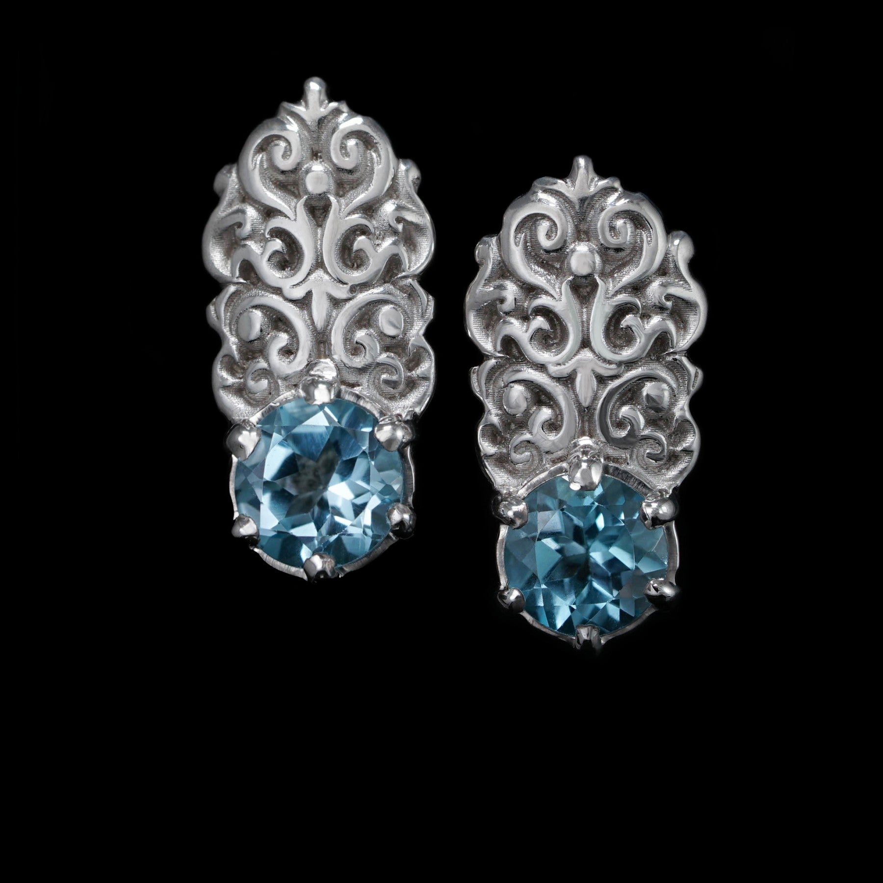 Sterling silver "Regal Grace" earrings with topazes, white rhodium plated, elegant design, enhances any outfit, celebrates uniqueness.