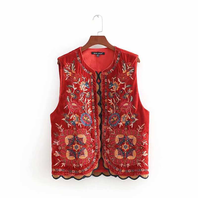 Red velvet Stylish Vyshyvanka waistcoat with intricate Ukrainian embroidery, perfect for a sophisticated commuter style look.