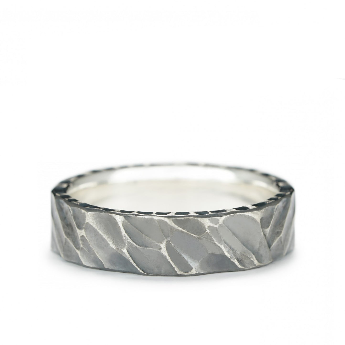 Sterling silver "Iron Edge" ring with oxidized textured finish, showcasing bold and rugged handcrafted design.