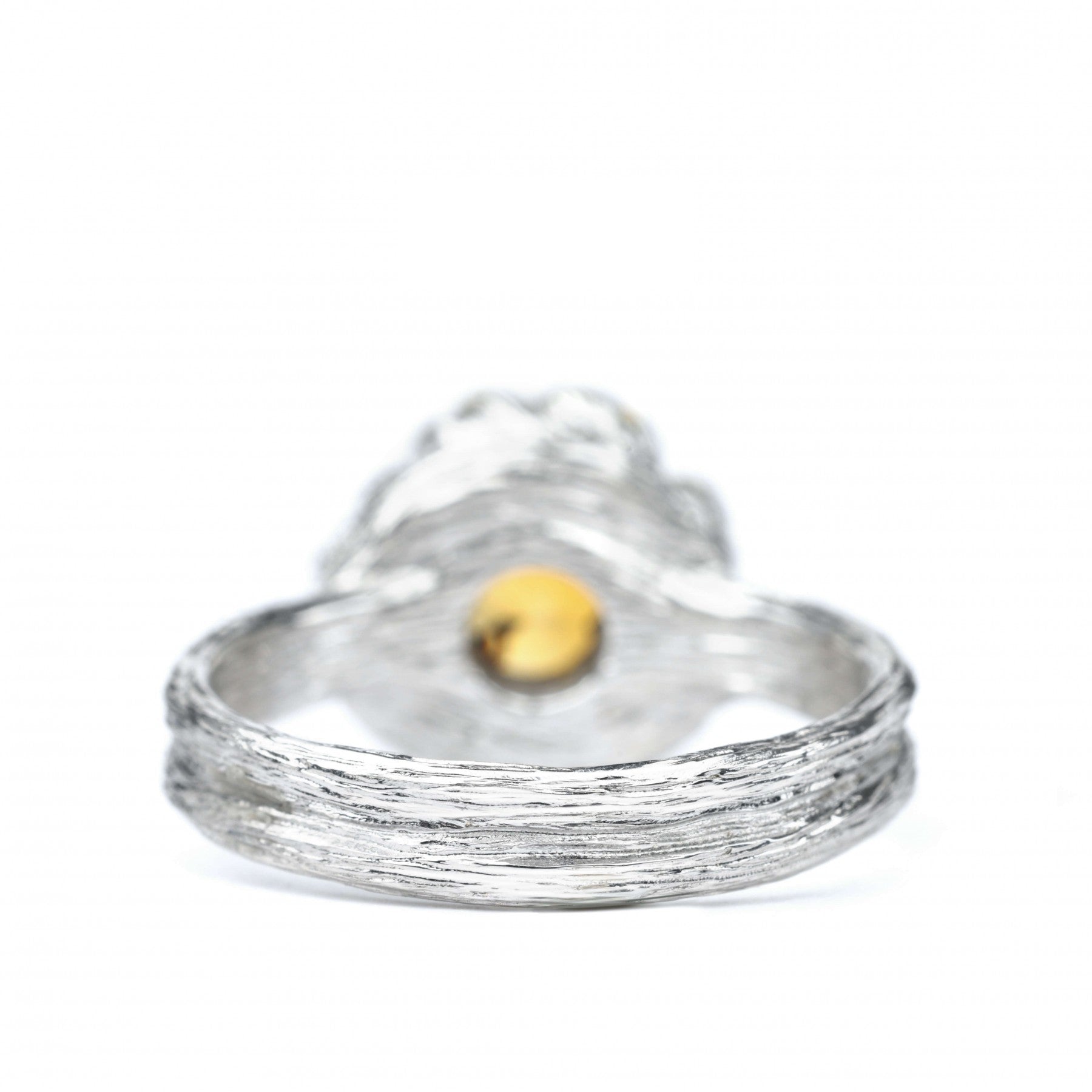 Sterling silver "Golden Blossom" ring with citrine center, inspired by peony petals, symbolizing nature’s beauty and prosperity.