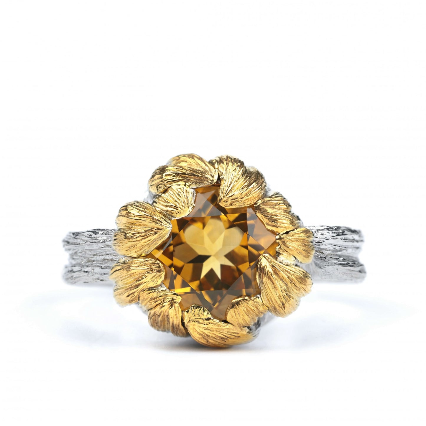 Sterling silver ring "Golden Blossom" with citrine and gold petals, inspired by nature's beauty, symbolizing growth and prosperity.