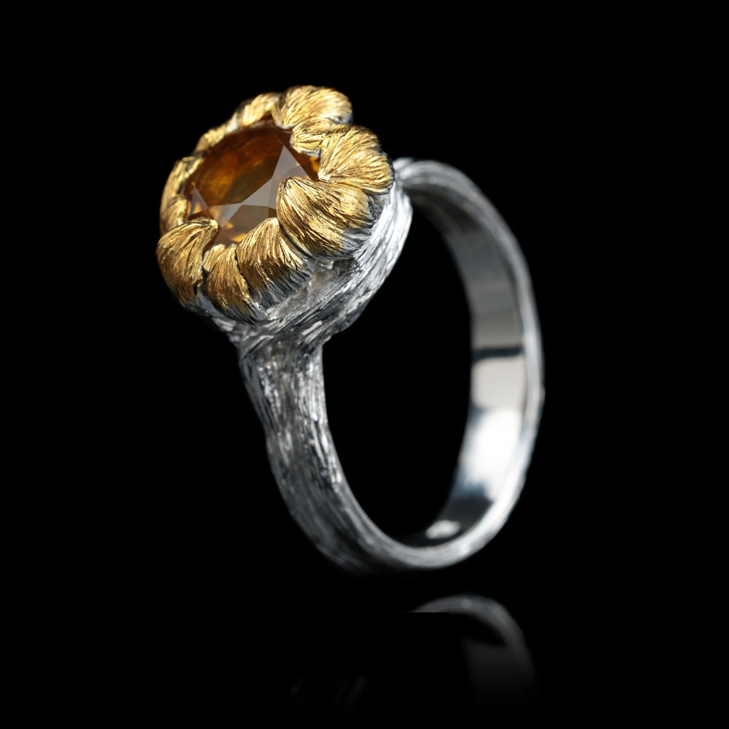 Sterling silver ring with citrine center, gold petals, inspired by peony flowers; the "Golden Blossom" ring symbolizes growth and elegance.