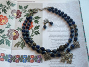 2025 Blue Ukrainian Necklace 'Magic of the Night' with Sodalite and Bronze Accents on Display Booklet