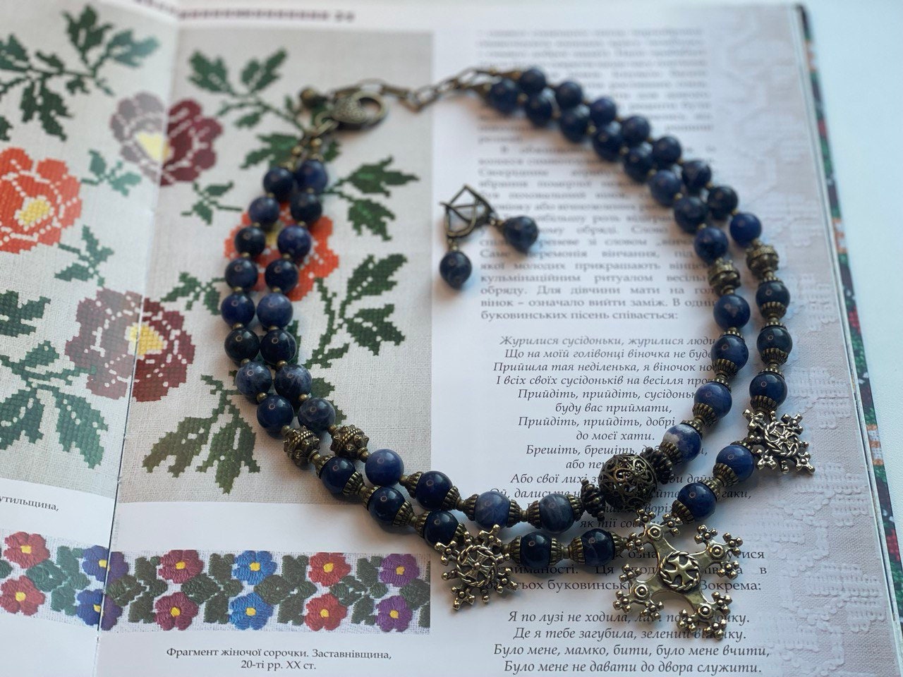 2025 Blue Ukrainian Necklace 'Magic of the Night' with Sodalite and Bronze Accents on Display Booklet