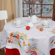 2025 Linen Embroidered Tablecloth with Ukrainian Easter Design, 140×140 cm, set with white teaware for festive décor
