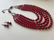 Red handmade Ukrainian necklace with pressed coral beads, traditional ethnic Hutsul jewelry, paired with matching earrings.