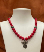 2025 Red Hutsul Necklace with Angel Pendant on Display – Handmade Pressed Coral Beads, Ukrainian Ethnic Jewelry