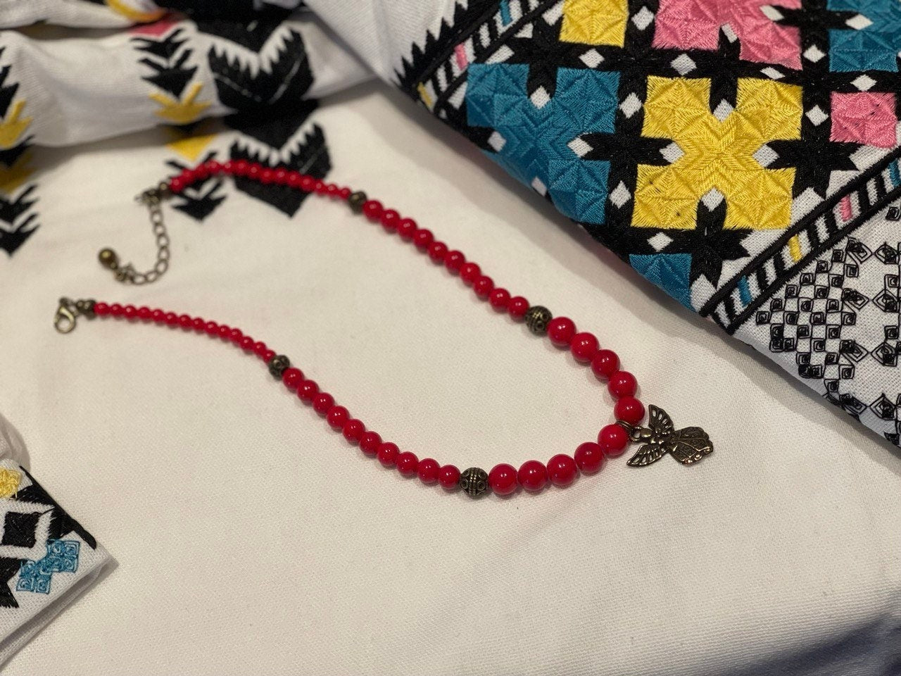 2025 Red Hutsul Necklace with Angel Pendant on traditional embroidered fabric, pressed coral beads, Ukrainian handmade jewelry.