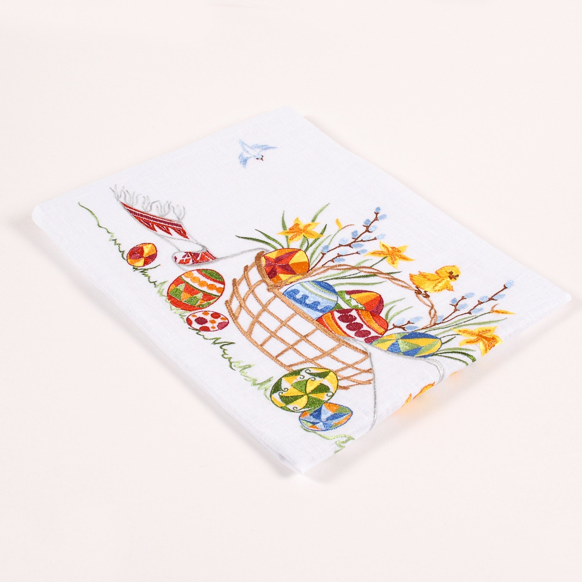 Linen tablecloth with colorful Ukrainian Easter embroidery featuring eggs and flowers, perfect for festive decor, size 140x140 cm.