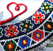 Ukrainian Sylyanka handmade beaded necklace with Czech seed beads, featuring vibrant geometric and floral patterns on a narrow collar.