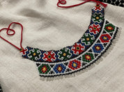 2025 Handmade Ukrainian Sylyanka necklace with colorful Czech seed beads on linen background
