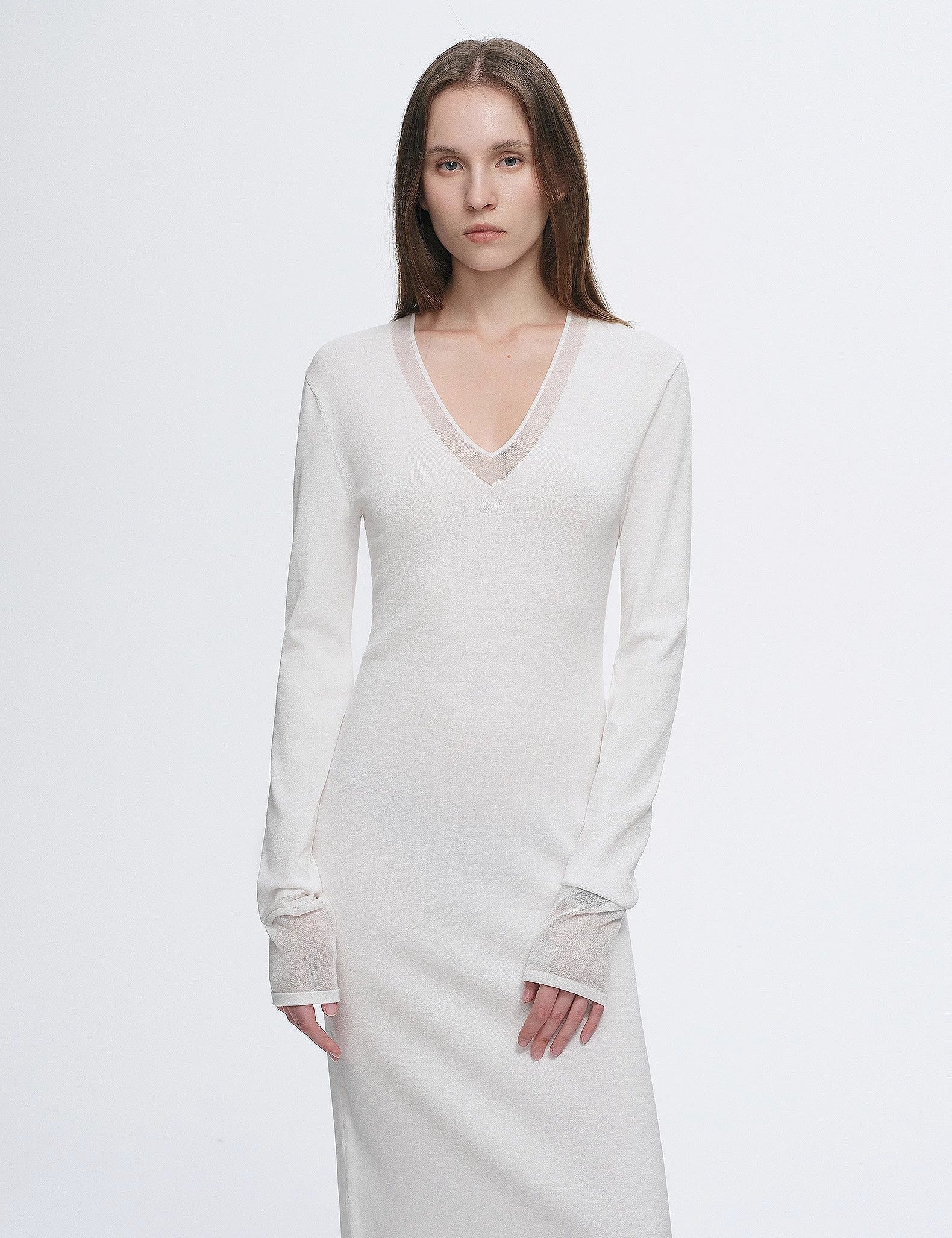 Virella Mesh-Splice V-Neck Dress showcasing minimalist design with sheer mesh panels and A-line silhouette.