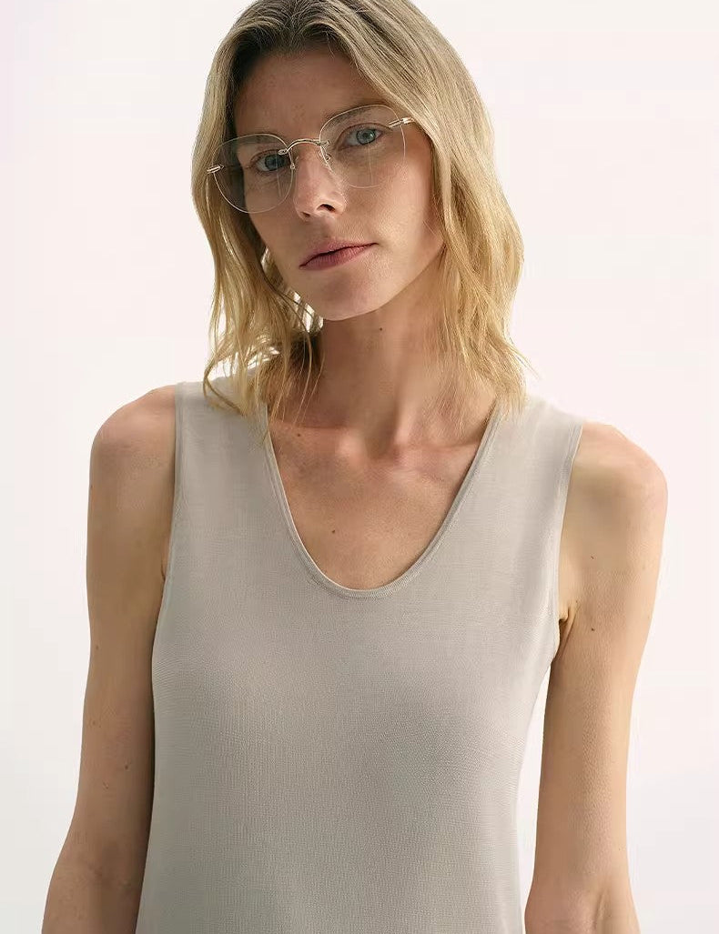 Woman wearing Sylvenia Fine Silk Knit Vest with U-neckline and elegant structure.