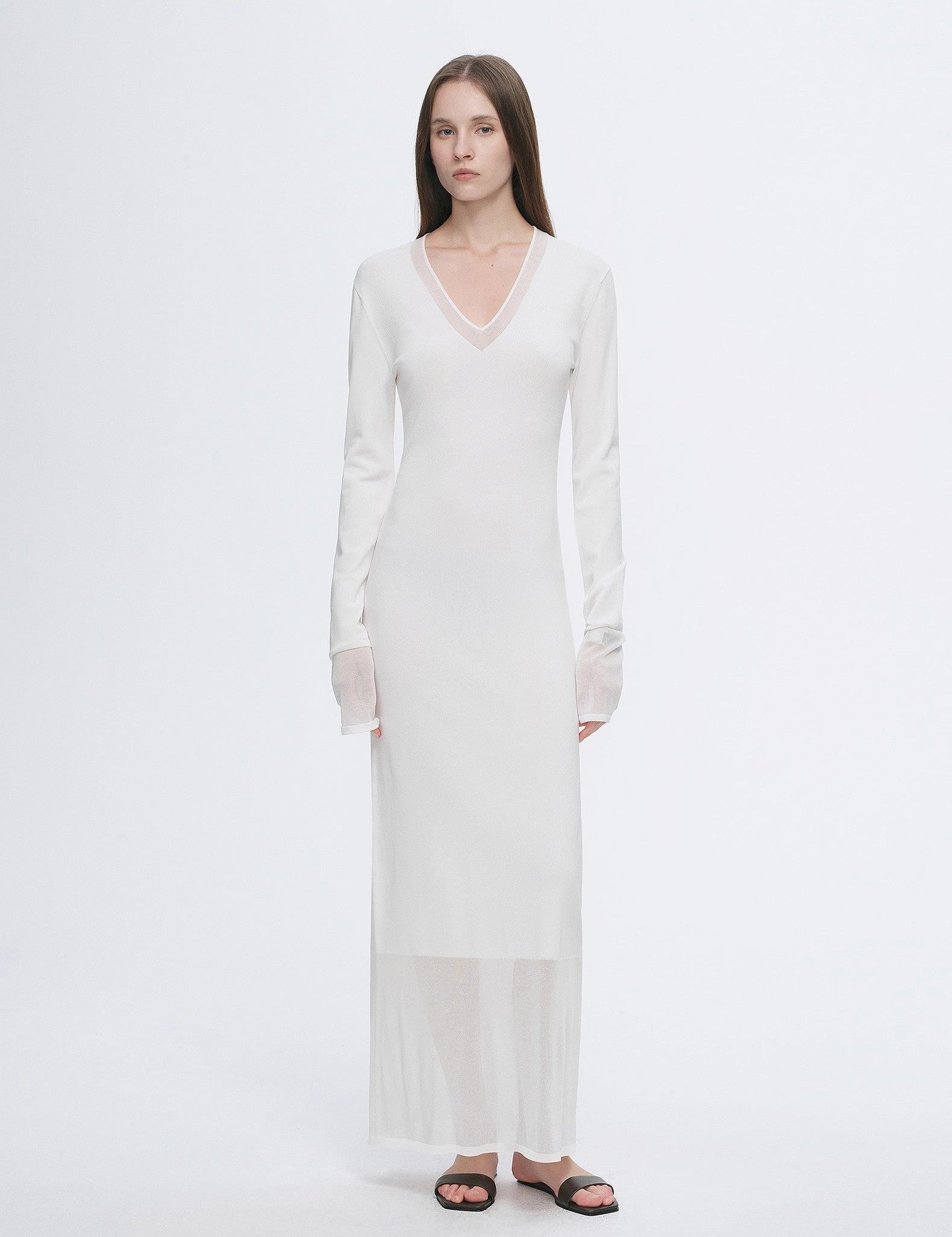 Virella Mesh-Splice V-Neck Dress with A-line cut and sheer mesh panels, showcasing minimalist design and modern elegance in white.