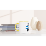 Irvelle ceramic mug with yellow accent, showcasing print design, beside books and decorative vases. Perfect for coffee or tea.