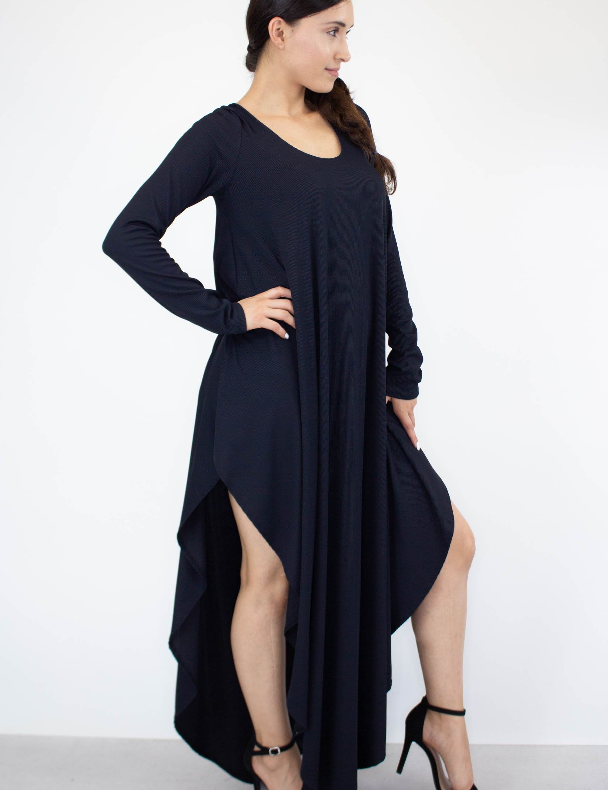Woman wearing Eloura Asymmetric Maxi Dress with long sleeves and a unique hemline, showcasing modern style and comfort.