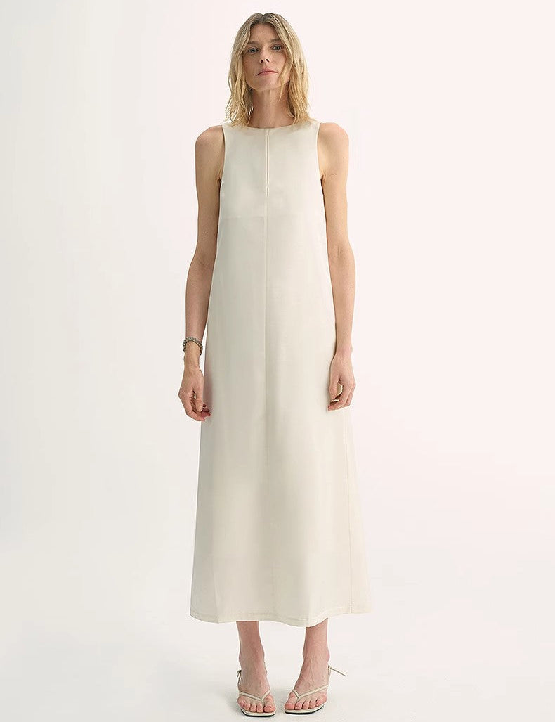 Woman modeling Corridor Stride Sleeveless Wool Blend Dress with teardrop back closure and discreet side pockets, vertical neckline.