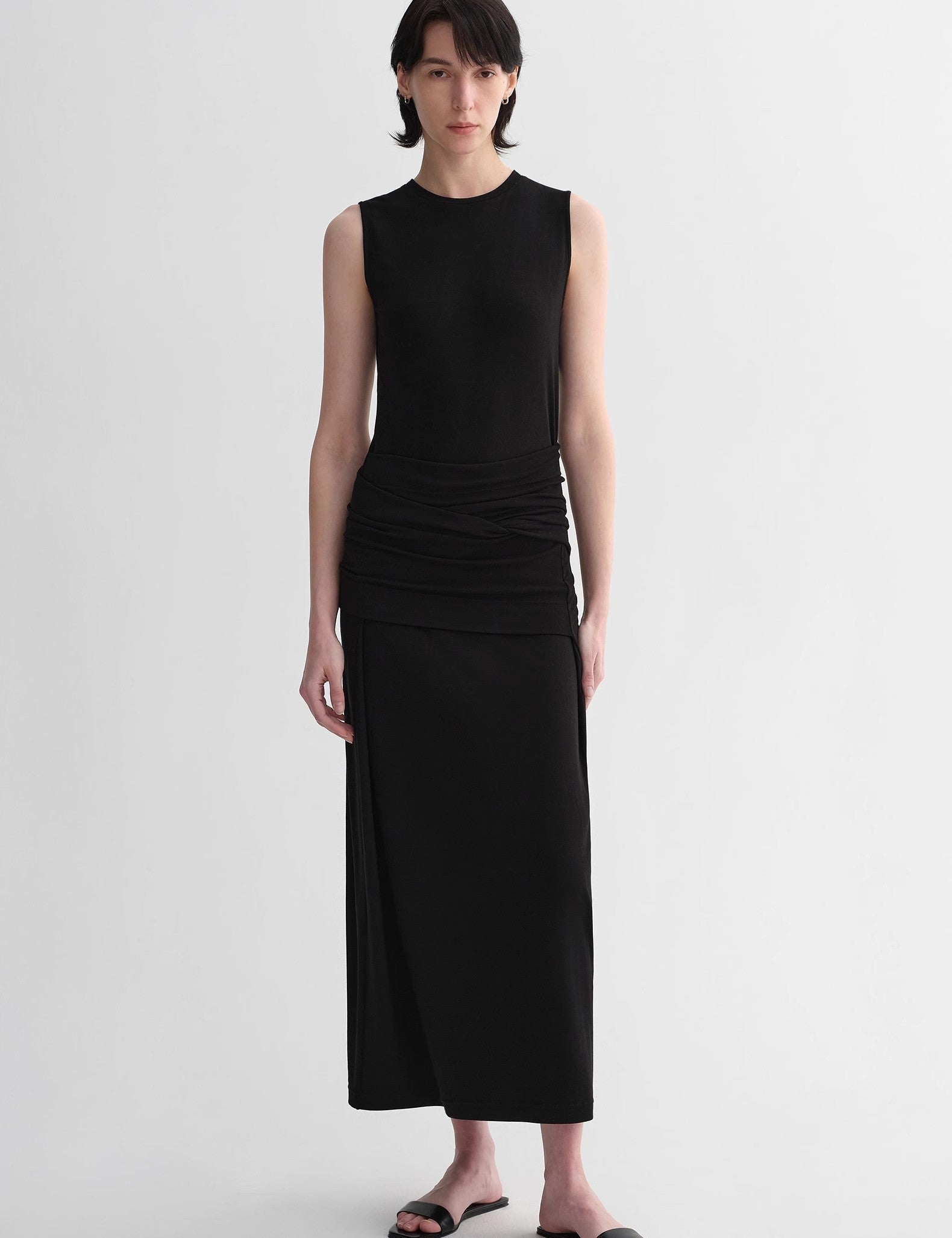 Model wearing Urban Sculpt Wool Blend Midi Dress with round neckline and tailored armholes, highlighting minimalist and elegant design.