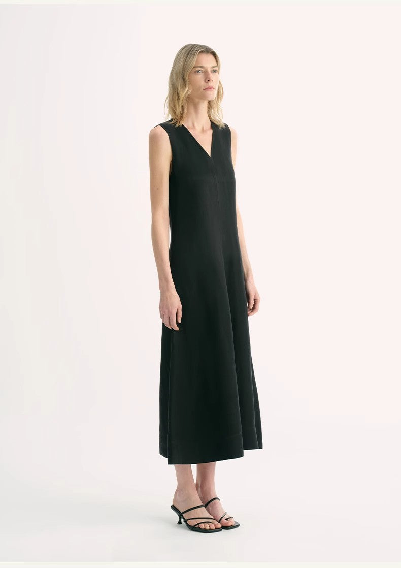 Aurevae Cupro-Linen A-Line Dress featuring a sleeveless, V-neck design with mid-calf length, shown on a model.