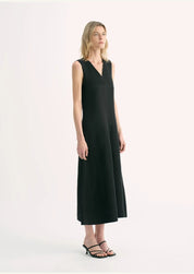 Aurevae Cupro-Linen A-Line Dress featuring a sleeveless, V-neck design with mid-calf length, shown on a model.