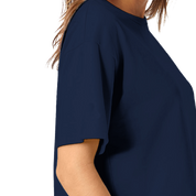 Woman wearing navy Virelle Cropped Cotton Tee with relaxed fit and ribbed collar, ideal for casual streetwear style.