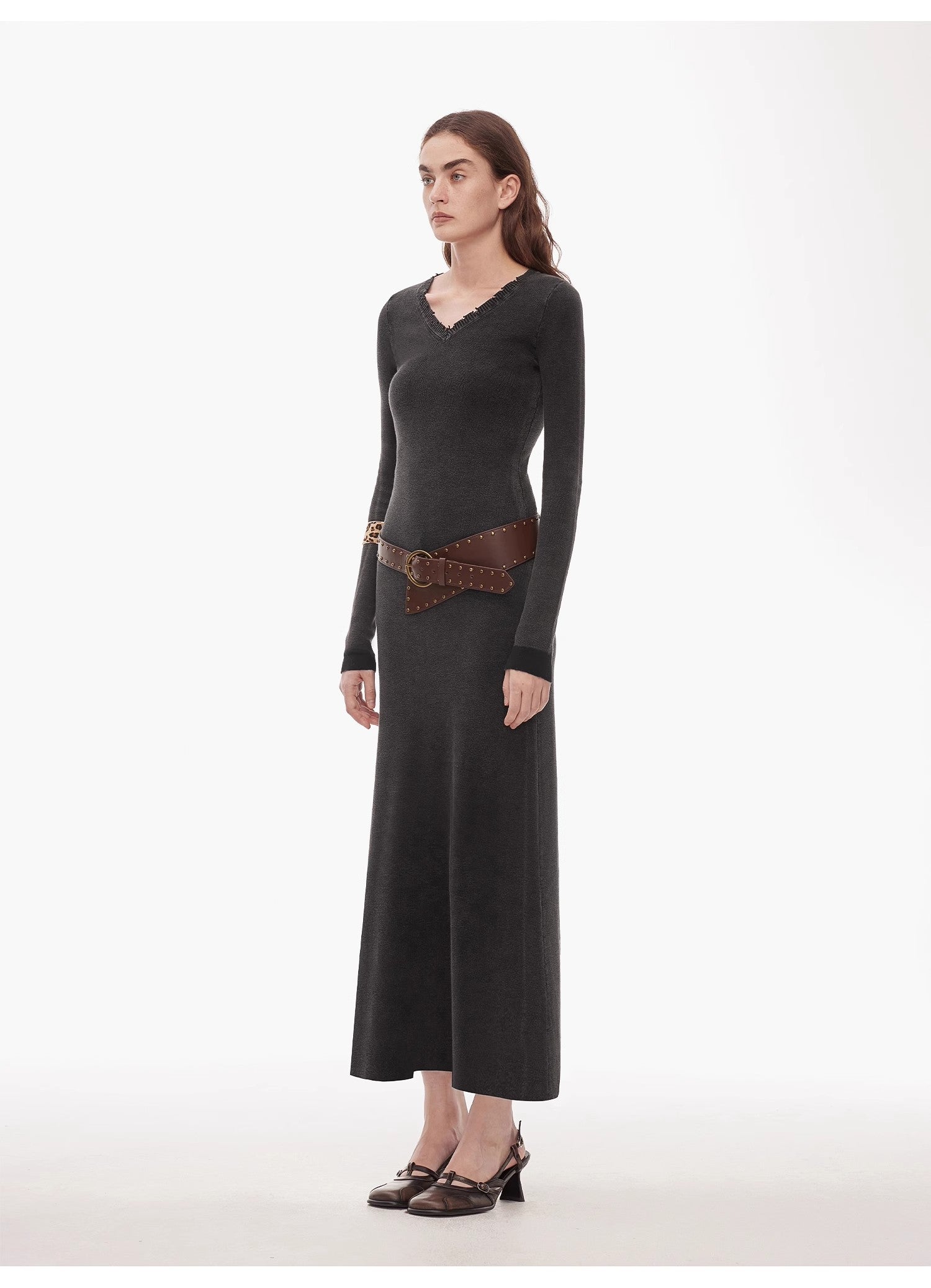 Selvara Distressed Cotton V-Neck Dress with raw edges and contrast cuffs, shown on a model standing against a plain background.