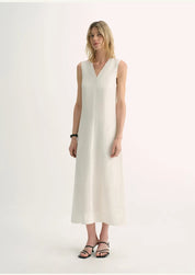 Aurevae Cupro-Linen A-Line Dress featuring a clean V-neck and sleeveless bodice, mid-calf length, in light breathable fabric with subtle sheen.