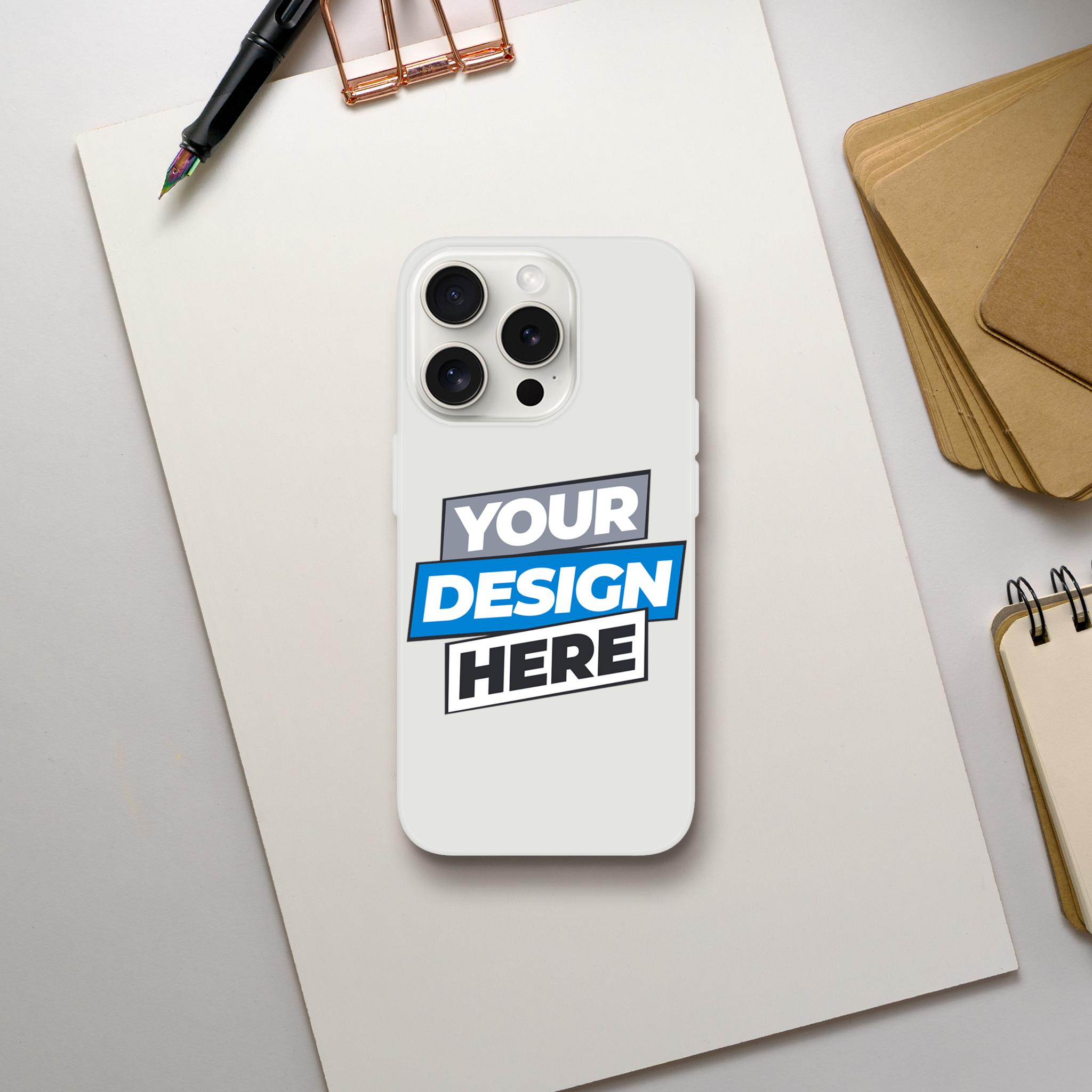 Flexi Case on desk, transparent with customizable design, impact-resistant, flexible, tear-resistant, wireless charging compatible.