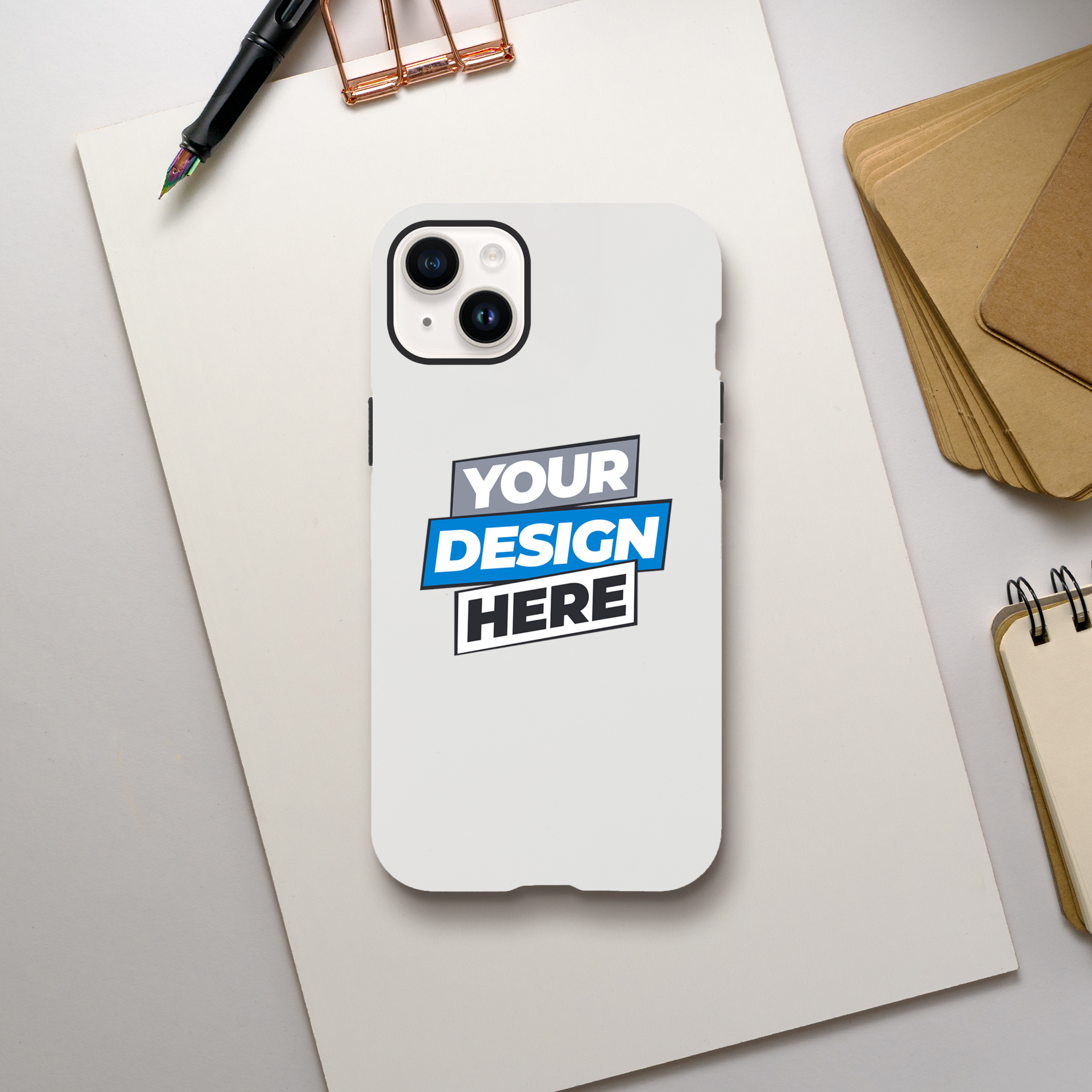 Glossy print on demand iPhone case with dual-layer protection and customizable design on a desk.