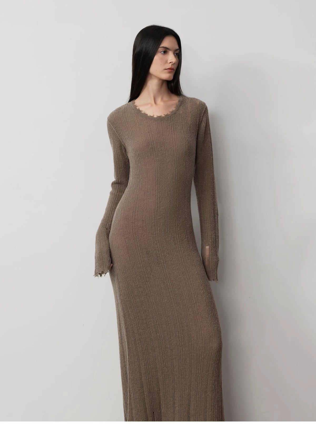 Fray Line Wool Knit Dress with frayed edges and subtle cut-outs, featuring a round neckline and slim-fit design for a contemporary look.
