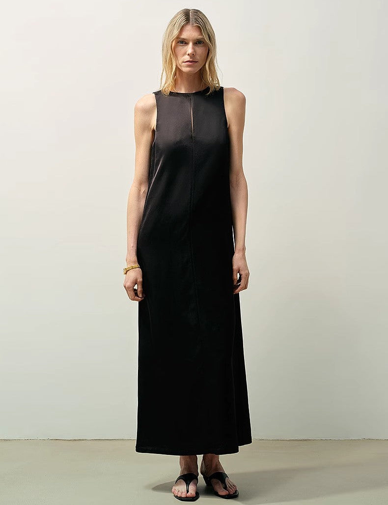 Woman wearing Corridor Stride sleeveless wool blend dress with teardrop back closure and side pockets on a plain background.