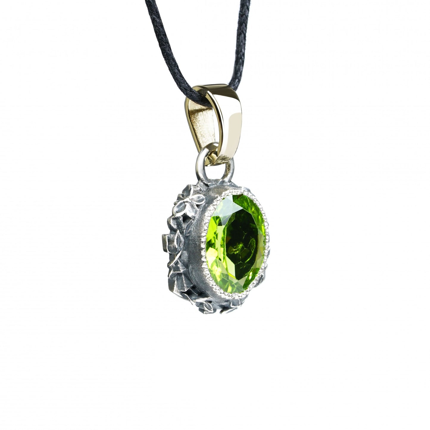 Oxidized sterling silver pendant with oval peridot, intricate flower design, and 14K gold clasp, "Enchanted Bloom".