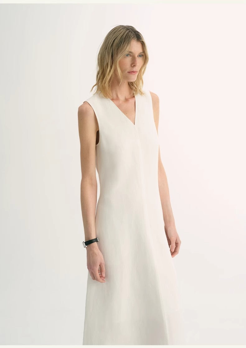 Model wearing Aurevae Cupro-Linen A-Line Dress with V-neck and sleeveless bodice, showcasing light, breathable fabric with subtle sheen.