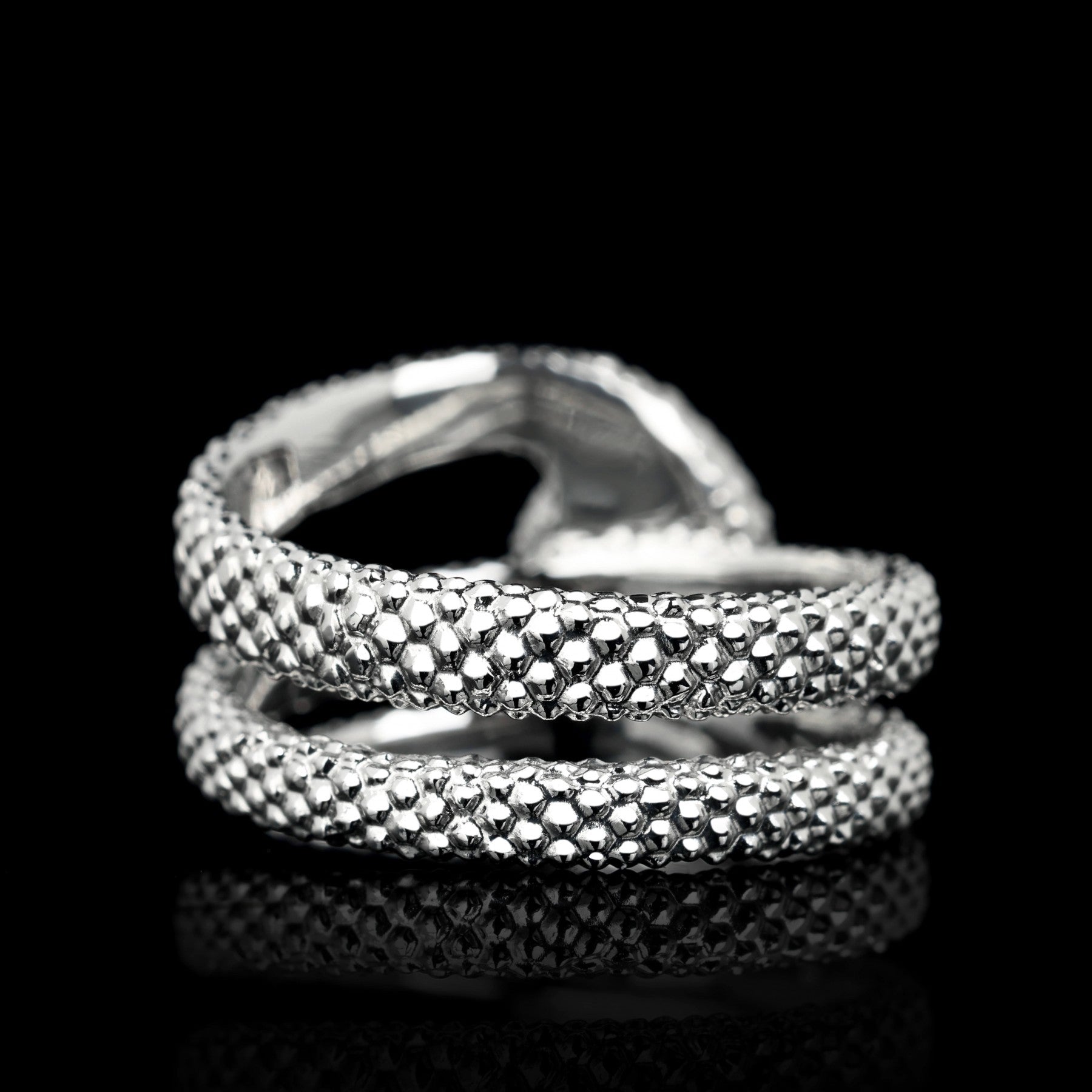 Textured white gold ring with snake motif, crafted for elegance and symbolism.