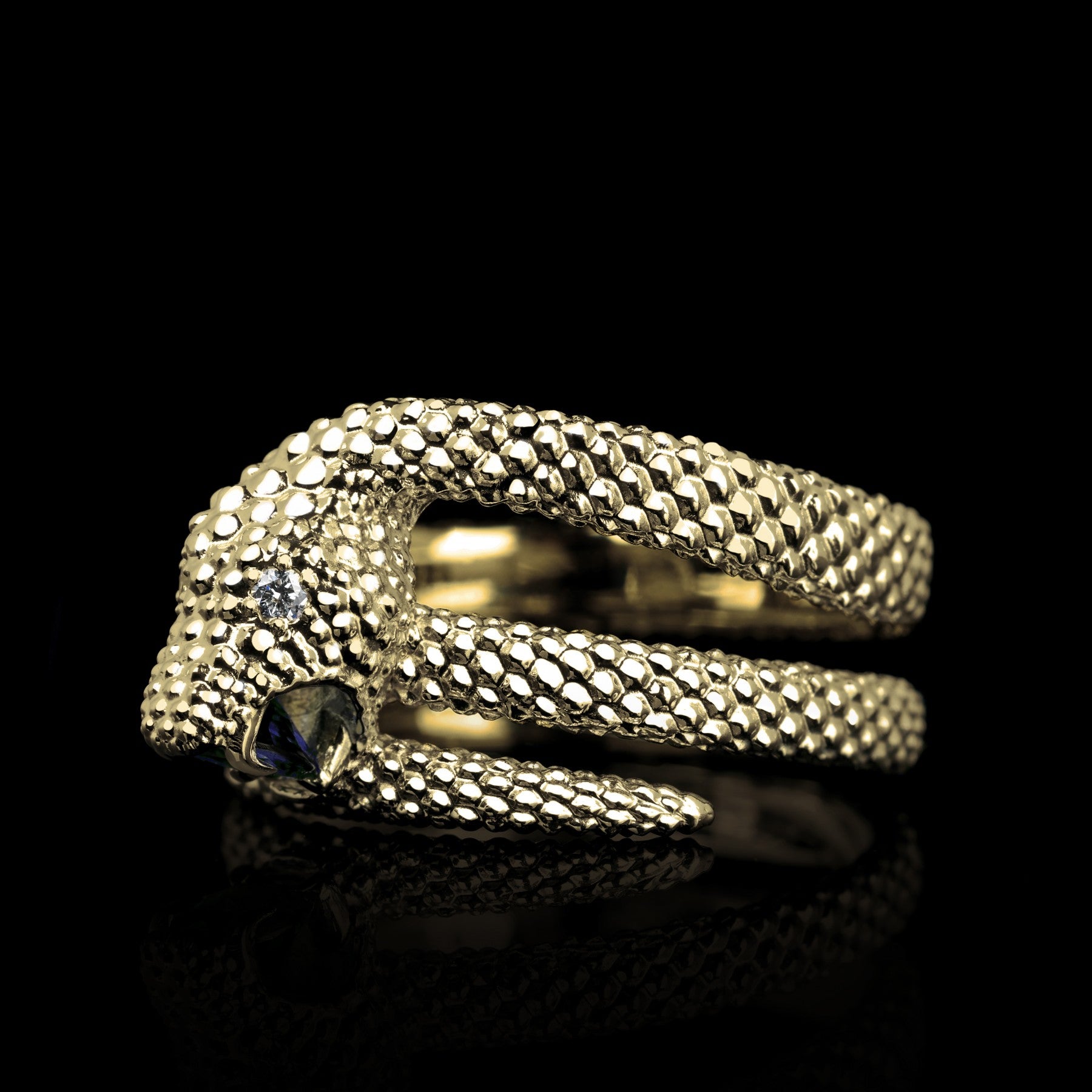 "Serpent Symphony yellow gold ring with blue sapphire and diamonds in snake motif"