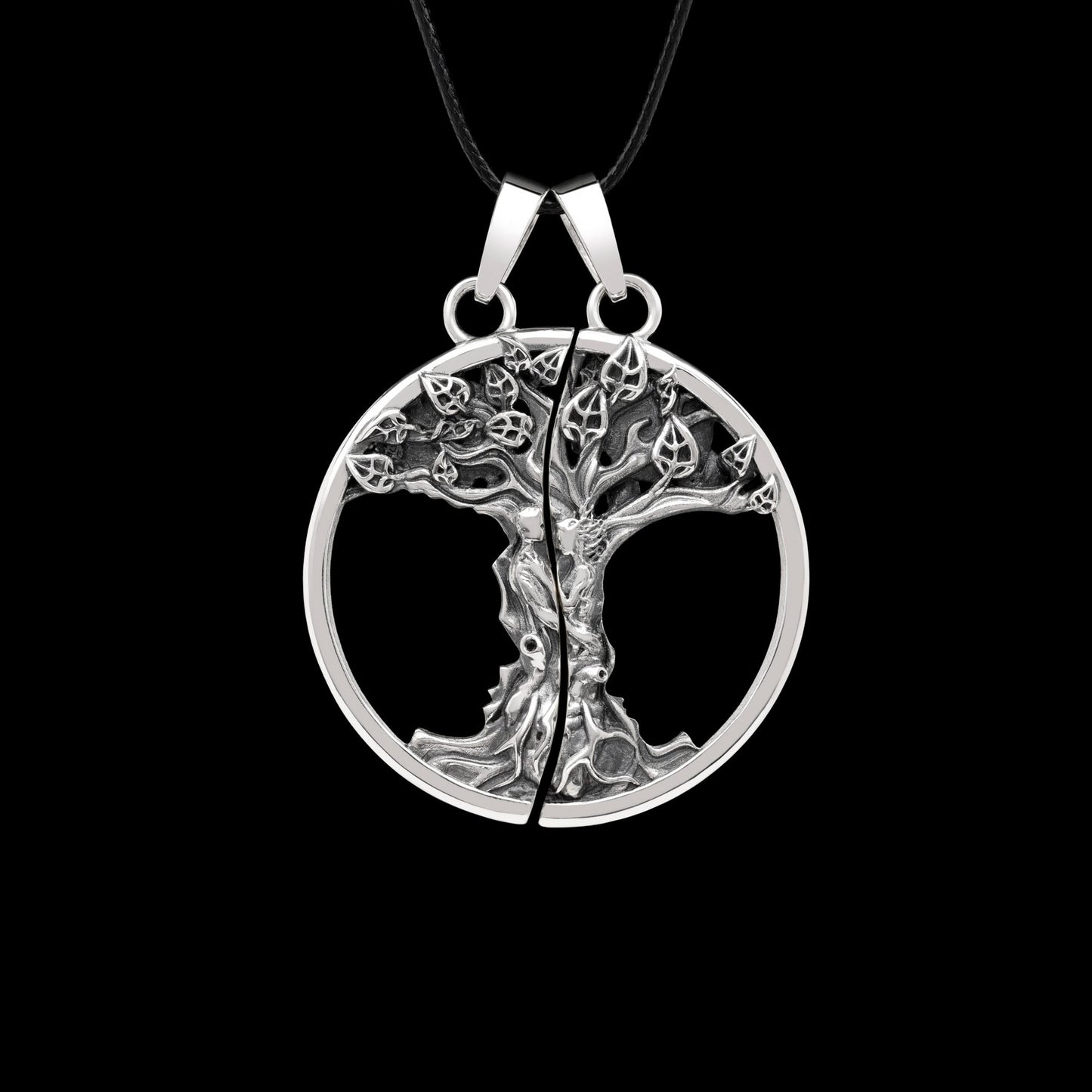 Double pendant "Primal Bond" in oxidized sterling silver featuring a double-disc tree design symbolizing connection and love.