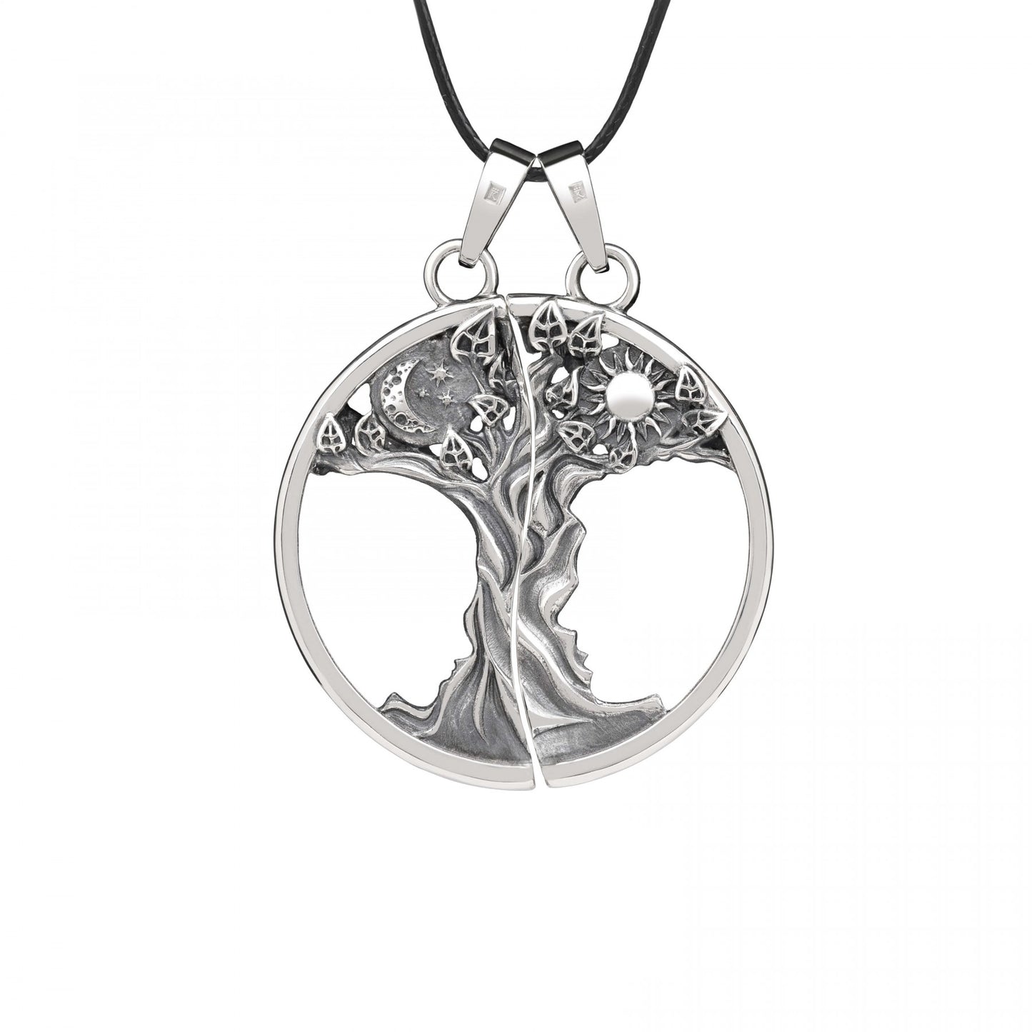 Double pendant "Primal Bond" in oxidized sterling silver with tree design, symbolizing connection and love, on black cord necklace.