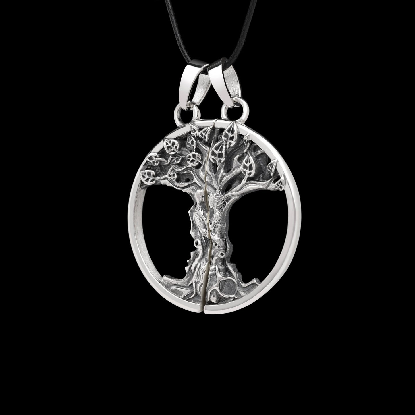 Oxidized sterling silver double pendant "Primal Bond" with intricate tree design, symbolizing connection and love.